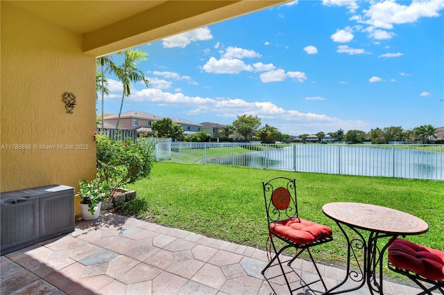 20656 SW 89th Ave, Cutler Bay, FL 33189 - view of yard with a patio area, a water view, and a fenced backyard