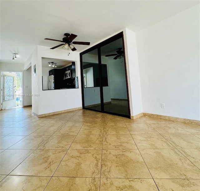450 E Paradise Isle Blvd Unit 208, Hallandale Beach, FL 33009 - unfurnished room with ceiling fan and baseboards