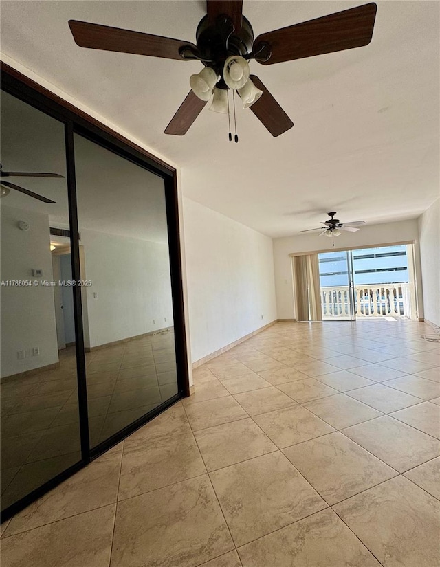 450 E Paradise Isle Blvd Unit 208, Hallandale Beach, FL 33009 - empty room featuring tile patterned flooring and a ceiling fan