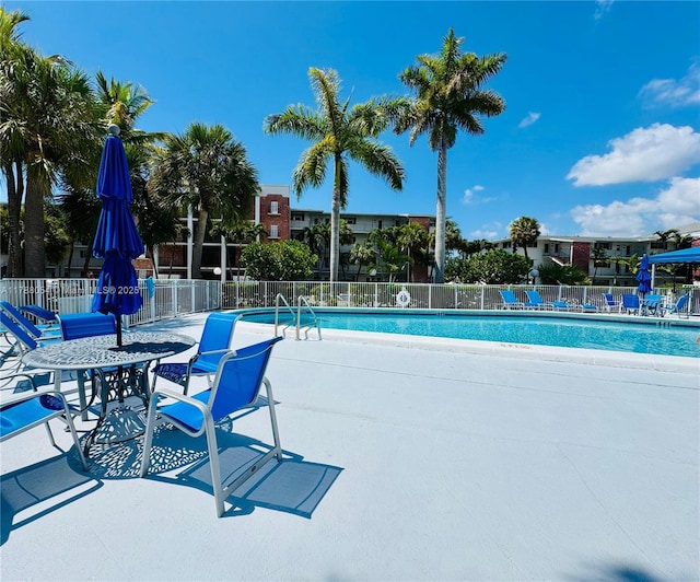 450 E Paradise Isle Blvd Unit 208, Hallandale Beach, FL 33009 - community pool featuring a patio