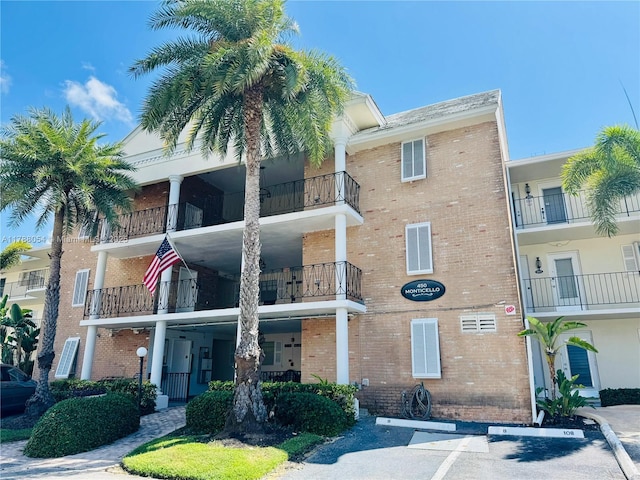 450 E Paradise Isle Blvd Unit 208, Hallandale Beach, FL 33009 - view of apartment building / complex featuring uncovered parking