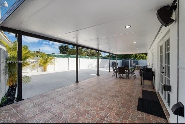 11245 SW 47th Ter, Miami, FL 33165 - view of patio / terrace featuring a fenced backyard, french doors, and outdoor dining area