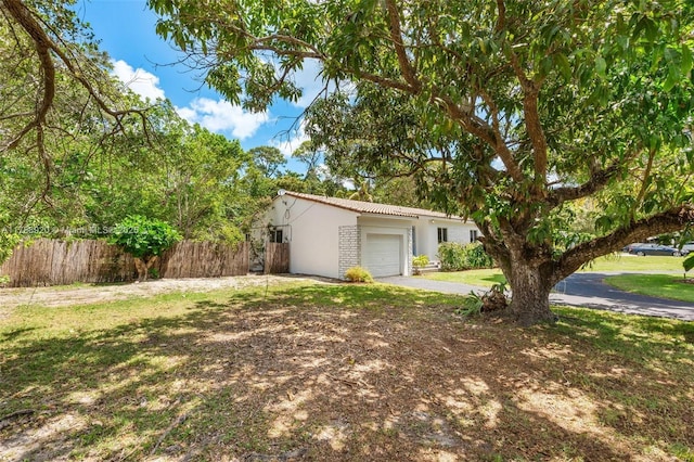 6845 SW 57th Ter, Miami, FL 33143 - view of yard with driveway and a garage