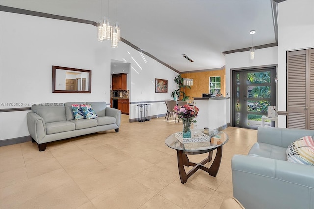 living room with lofted ceiling, light tile patterned floors, crown molding, baseboards, and a notable chandelier