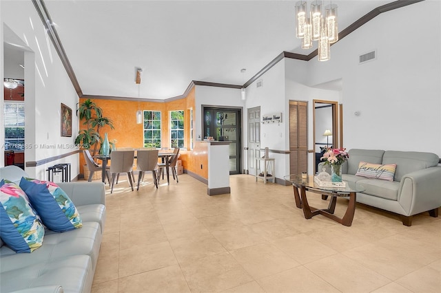 living area featuring vaulted ceiling, visible vents, an inviting chandelier, and crown molding