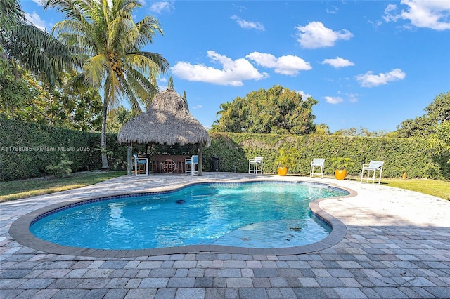 view of pool with a fenced backyard, a gazebo, a patio, and a fenced in pool