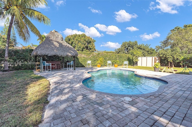 outdoor pool featuring a gazebo, a patio area, and fence private yard