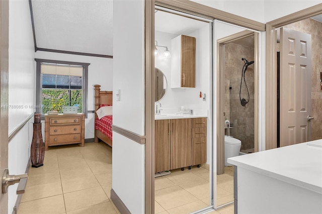 full bath with vanity, tile patterned flooring, ornamental molding, and tiled shower