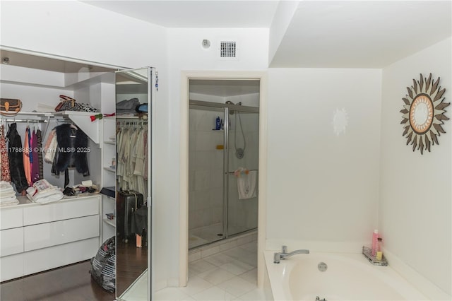3530 Mystic Pointe Dr Unit 2910, Aventura, FL 33180 - full bath featuring a walk in closet, a garden tub, visible vents, and a stall shower