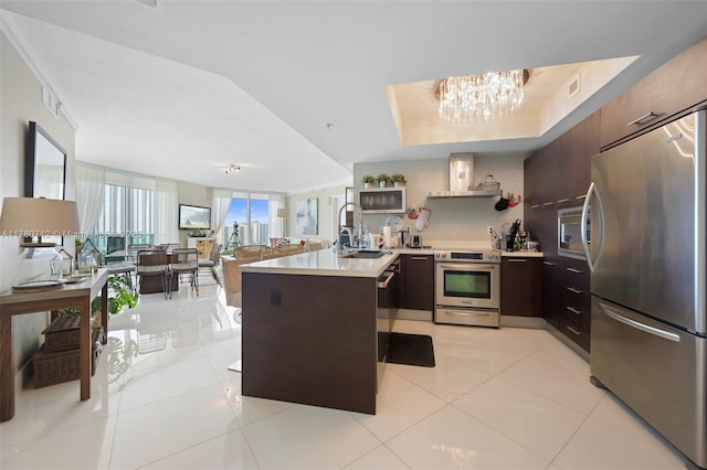 250 Sunny Isles Blvd Unit 3-1505, Sunny Isles Beach, FL 33160 - kitchen with appliances with stainless steel finishes, a peninsula, light countertops, and modern cabinets