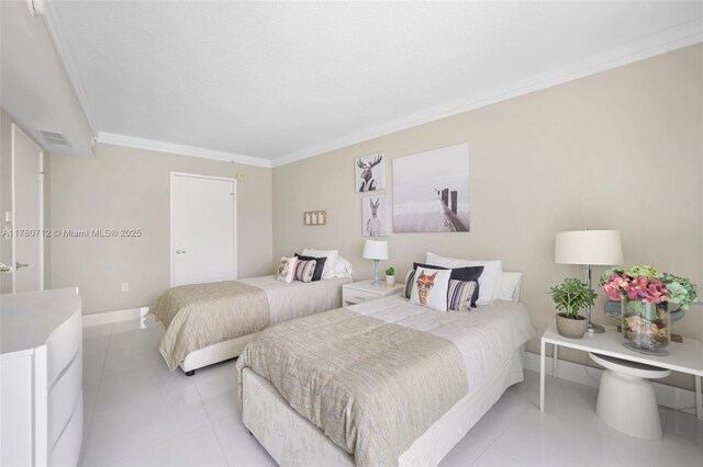 250 Sunny Isles Blvd Unit 3-1505, Sunny Isles Beach, FL 33160 - bedroom with ornamental molding and light tile patterned floors