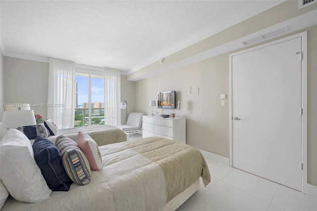 250 Sunny Isles Blvd Unit 3-1505, Sunny Isles Beach, FL 33160 - bedroom featuring light tile patterned flooring, a textured ceiling, and crown molding
