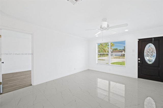 foyer featuring visible vents, baseboards, marble finish floor, ceiling fan, and ornamental molding