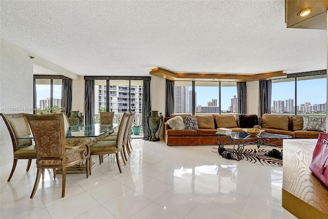 3000 Island Blvd Unit 706, Aventura, FL 33160 - dining space featuring a textured ceiling, a view of skyline, and light tile patterned floors