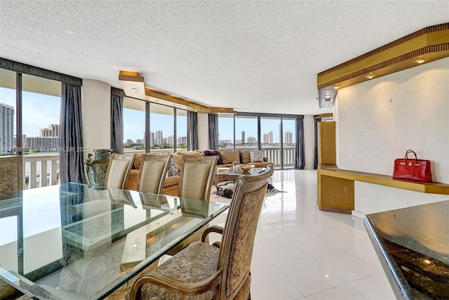 3000 Island Blvd Unit 706, Aventura, FL 33160 - dining room with a skyline view, a textured ceiling, floor to ceiling windows, and plenty of natural light