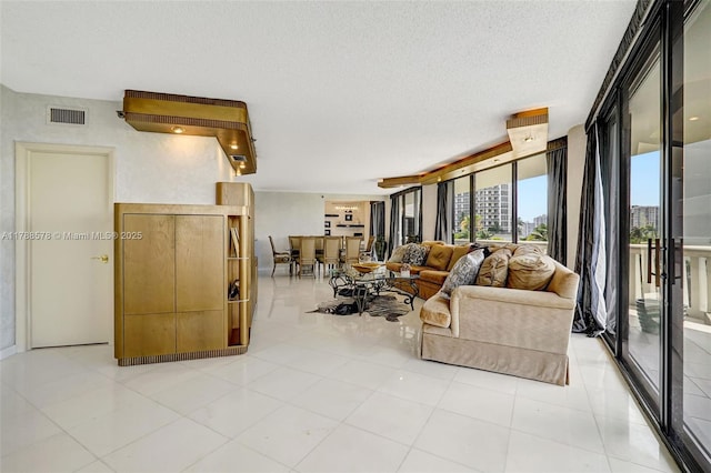 3000 Island Blvd Unit 706, Aventura, FL 33160 - living area featuring a textured ceiling and light tile patterned floors