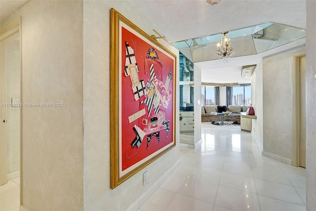 3000 Island Blvd Unit 706, Aventura, FL 33160 - corridor featuring a chandelier