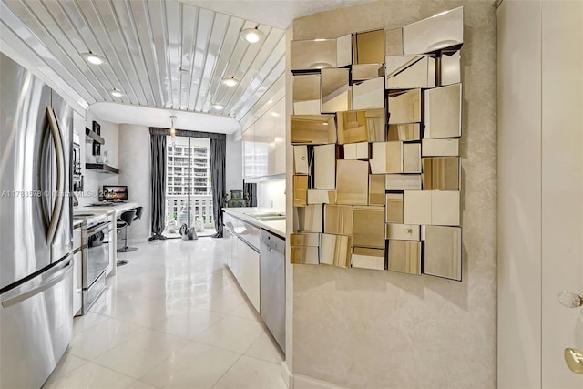 3000 Island Blvd Unit 706, Aventura, FL 33160 - kitchen with appliances with stainless steel finishes, light tile patterned flooring, light countertops, and a sink