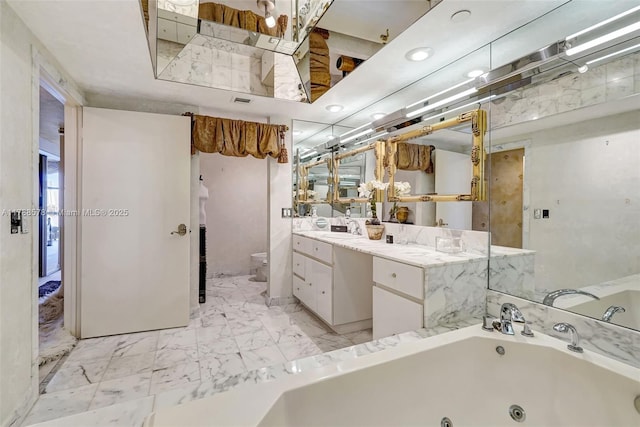 3000 Island Blvd Unit 706, Aventura, FL 33160 - full bathroom featuring toilet, vanity, a jetted tub, and marble finish flooring