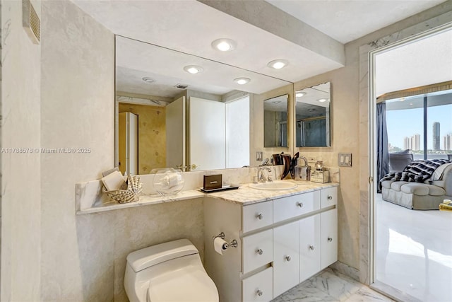 3000 Island Blvd Unit 706, Aventura, FL 33160 - ensuite bathroom featuring vanity, marble finish flooring, and toilet