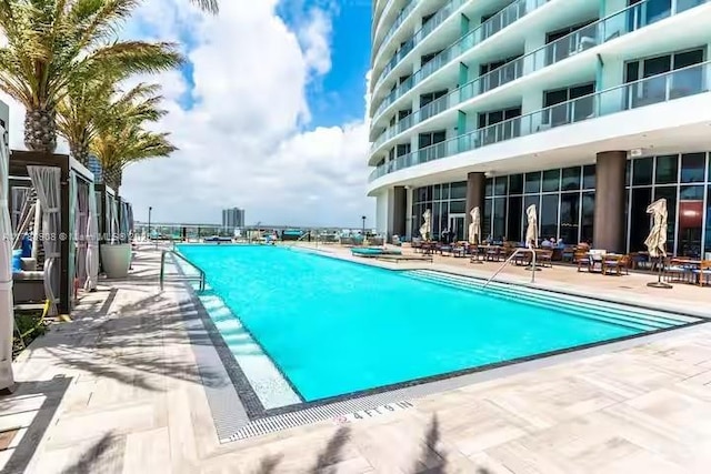 4111 S Ocean Dr Unit 1801, Hollywood, FL 33019 - community pool featuring a patio