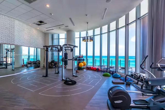 4111 S Ocean Dr Unit 1801, Hollywood, FL 33019 - exercise room with expansive windows, a water view, a high ceiling, and visible vents