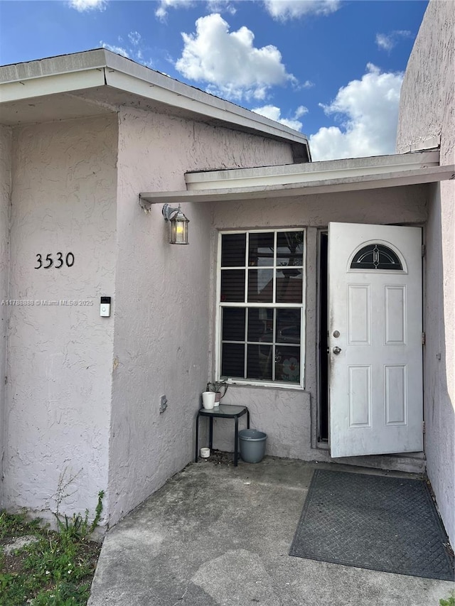 3530 NW 194th Ter, Miami Gardens, FL 33056 - view of exterior entry with stucco siding