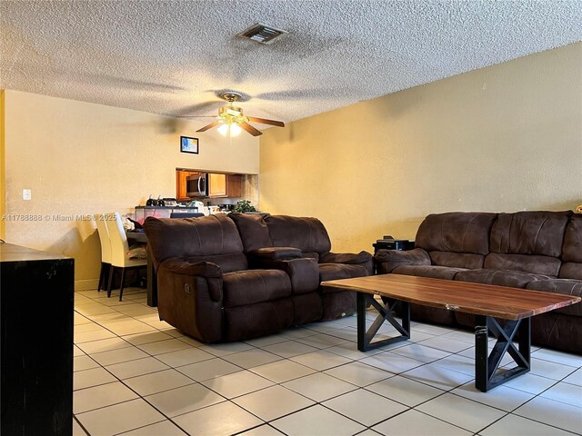 3530 NW 194th Ter, Miami Gardens, FL 33056 - living area featuring a ceiling fan, visible vents, a textured ceiling, and light tile patterned flooring