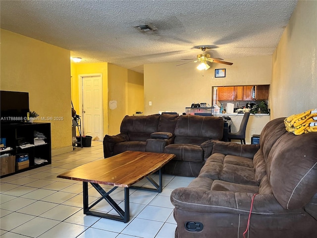 3530 NW 194th Ter, Miami Gardens, FL 33056 - living area with a textured ceiling, visible vents, ceiling fan, and light tile patterned floors