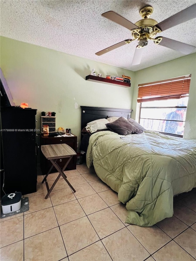 3530 NW 194th Ter, Miami Gardens, FL 33056 - bedroom with a ceiling fan, a textured ceiling, and light tile patterned floors