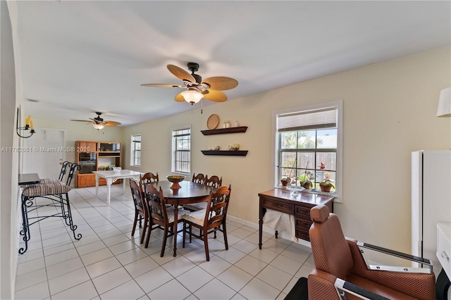 11421 NW 37th Pl, Sunrise, FL 33323 - dining space featuring ceiling fan, light tile patterned floors, and baseboards