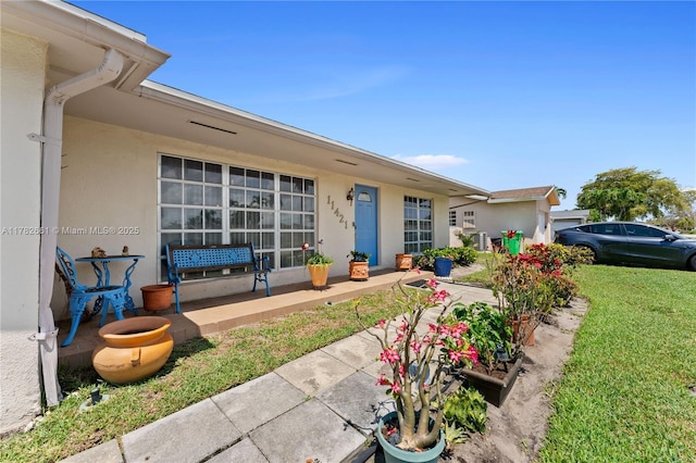 11421 NW 37th Pl, Sunrise, FL 33323 - entrance to property featuring a lawn and stucco siding