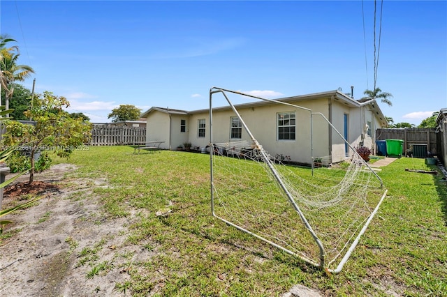 11421 NW 37th Pl, Sunrise, FL 33323 - rear view of property with stucco siding and central AC unit