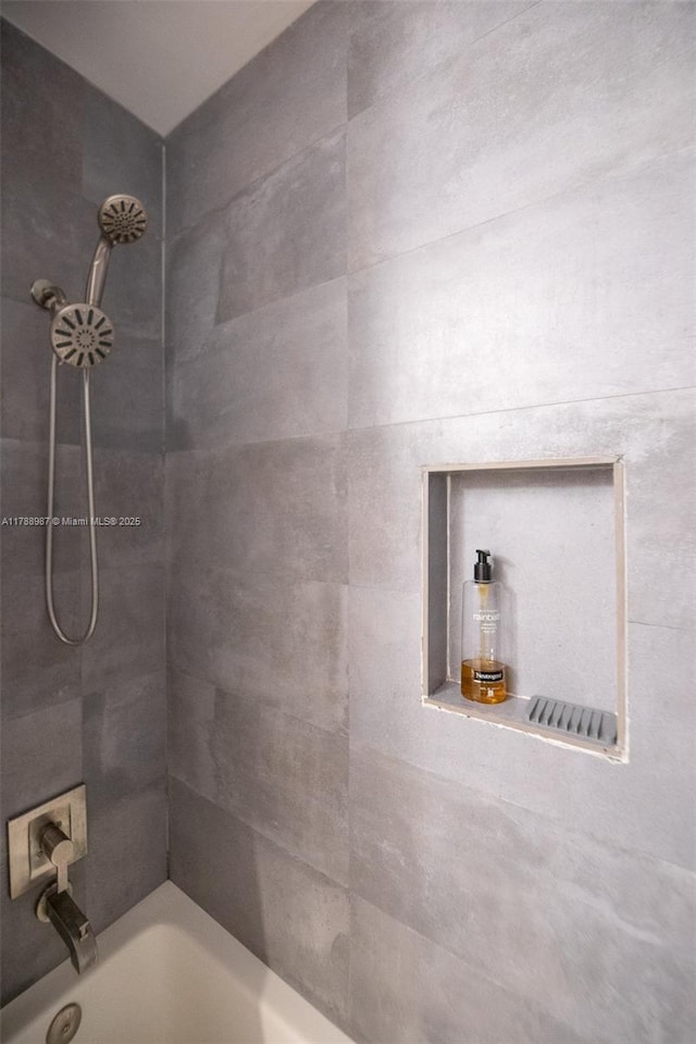 bathroom featuring  shower combination