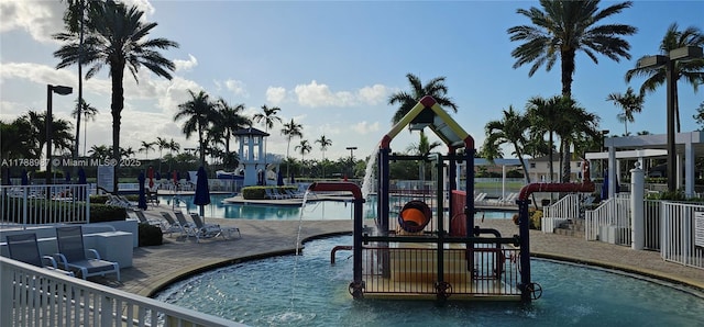 pool with fence and a patio