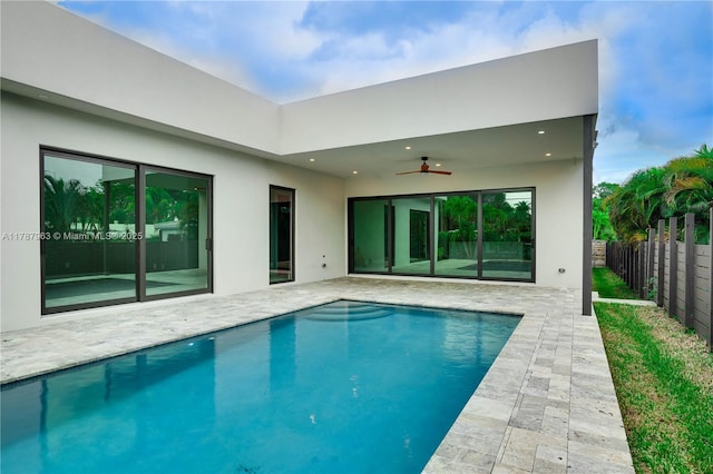 1733 NE 16th Ter, Fort Lauderdale, FL 33305 - back of property with a fenced in pool, fence, a patio area, a ceiling fan, and stucco siding