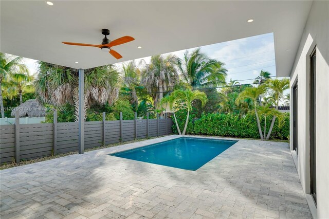 1733 NE 16th Ter, Fort Lauderdale, FL 33305 - view of swimming pool with ceiling fan, a fenced backyard, a fenced in pool, and a patio