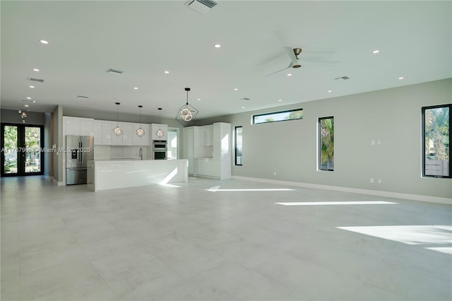 1733 NE 16th Ter, Fort Lauderdale, FL 33305 - interior space with ceiling fan, a healthy amount of sunlight, french doors, and recessed lighting