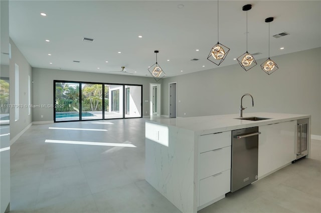 1733 NE 16th Ter, Fort Lauderdale, FL 33305 - kitchen with recessed lighting, visible vents, a sink, modern cabinets, and white cabinetry