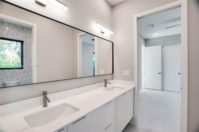 1733 NE 16th Ter, Fort Lauderdale, FL 33305 - bathroom with double vanity, visible vents, toilet, and a sink