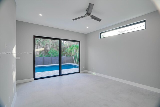 1733 NE 16th Ter, Fort Lauderdale, FL 33305 - empty room with baseboards, ceiling fan, and a healthy amount of sunlight