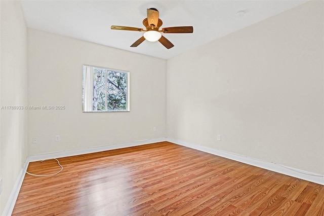8308 Santa Monica Ave, Tamarac, FL 33321 - spare room featuring light wood-type flooring, baseboards, a ceiling fan, and a smoke detector