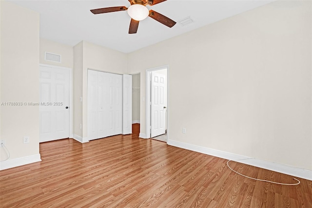 8308 Santa Monica Ave, Tamarac, FL 33321 - unfurnished bedroom featuring light wood-style floors, baseboards, a closet, and a ceiling fan