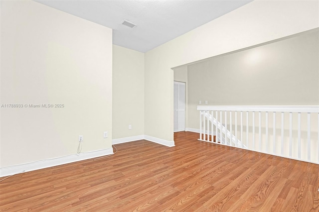 8308 Santa Monica Ave, Tamarac, FL 33321 - empty room with light wood-type flooring and baseboards