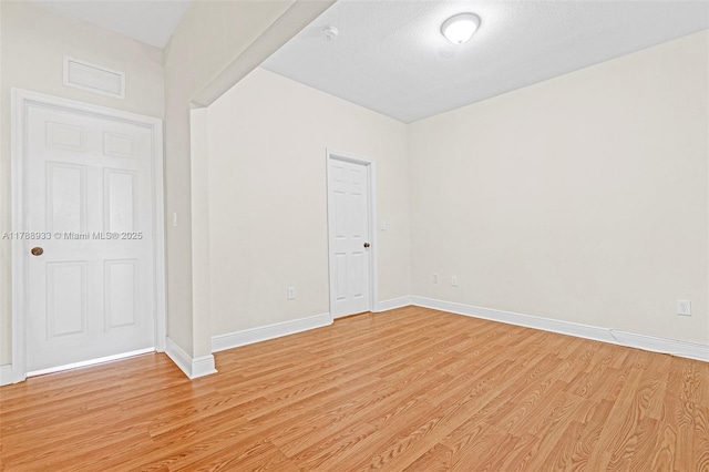 8308 Santa Monica Ave, Tamarac, FL 33321 - spare room featuring light wood-style floors, baseboards, and a smoke detector