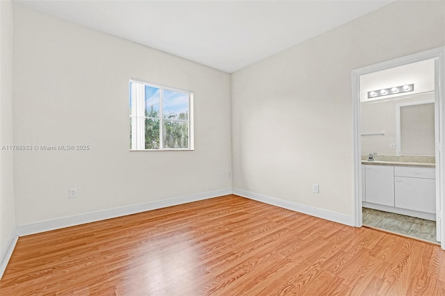 8308 Santa Monica Ave, Tamarac, FL 33321 - empty room with light wood-style floors and baseboards