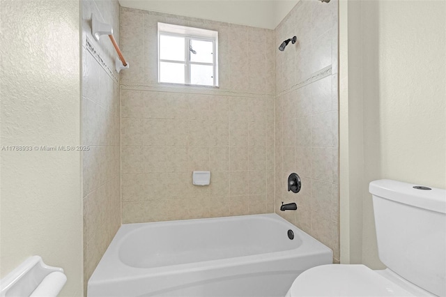 bathroom featuring toilet and bathtub / shower combination