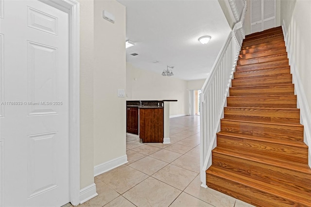8308 Santa Monica Ave, Tamarac, FL 33321 - stairway with tile patterned flooring and baseboards