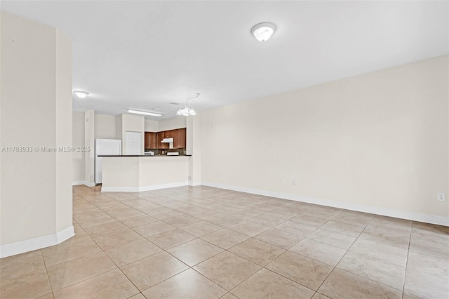 8308 Santa Monica Ave, Tamarac, FL 33321 - unfurnished living room featuring light tile patterned floors and baseboards
