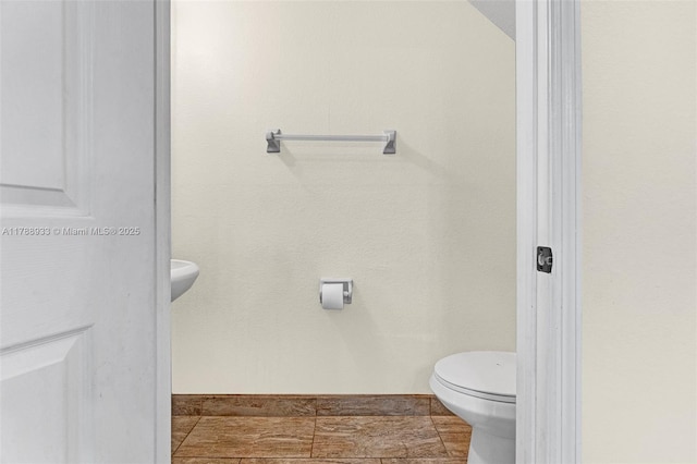 bathroom featuring toilet
